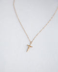 Dainty gold cross necklace