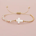 Dainty adjustable beaded cross bracelet