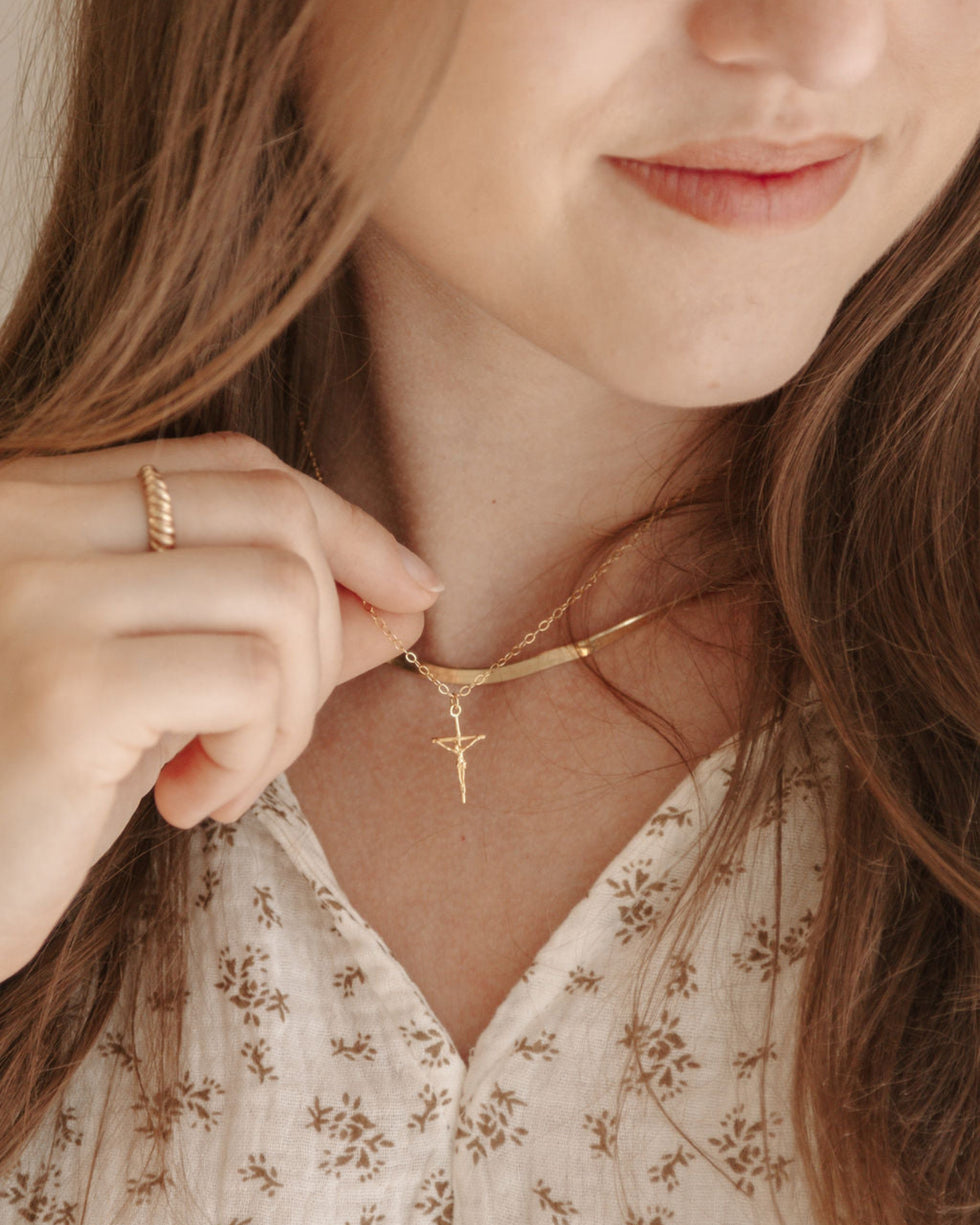 Dainty gold cross necklace